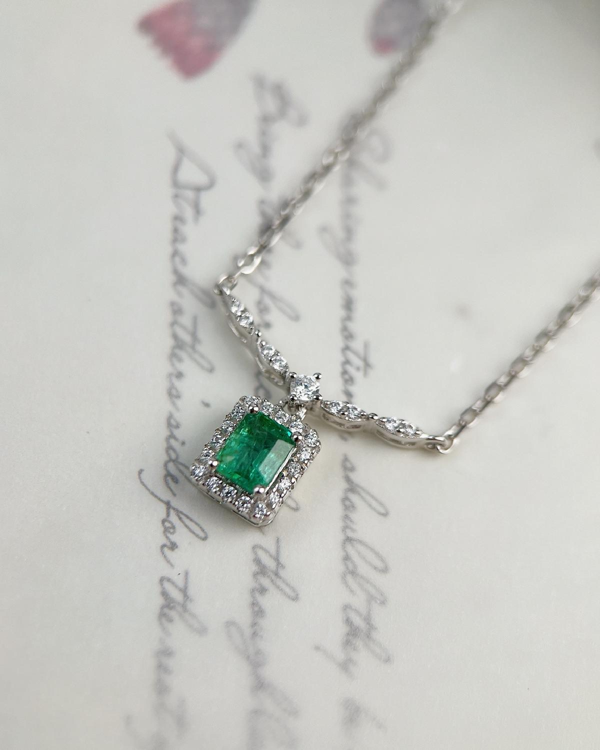 Macro shot of Dainty emerald necklace sterling silver featuring Green Emerald