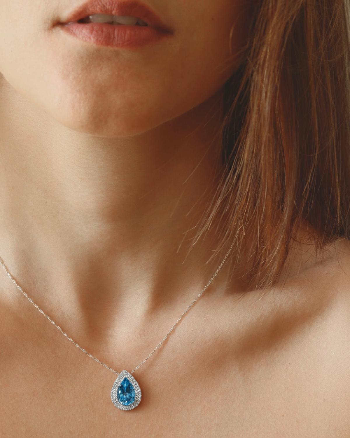 Model wearing Halo Blue Topaz Necklace Silver, ideal Anniversary or Mother's Day gift