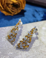 Lifestyle photography of Marquise yellow tourmaline drop earrings featuring Marquise Cut center stone