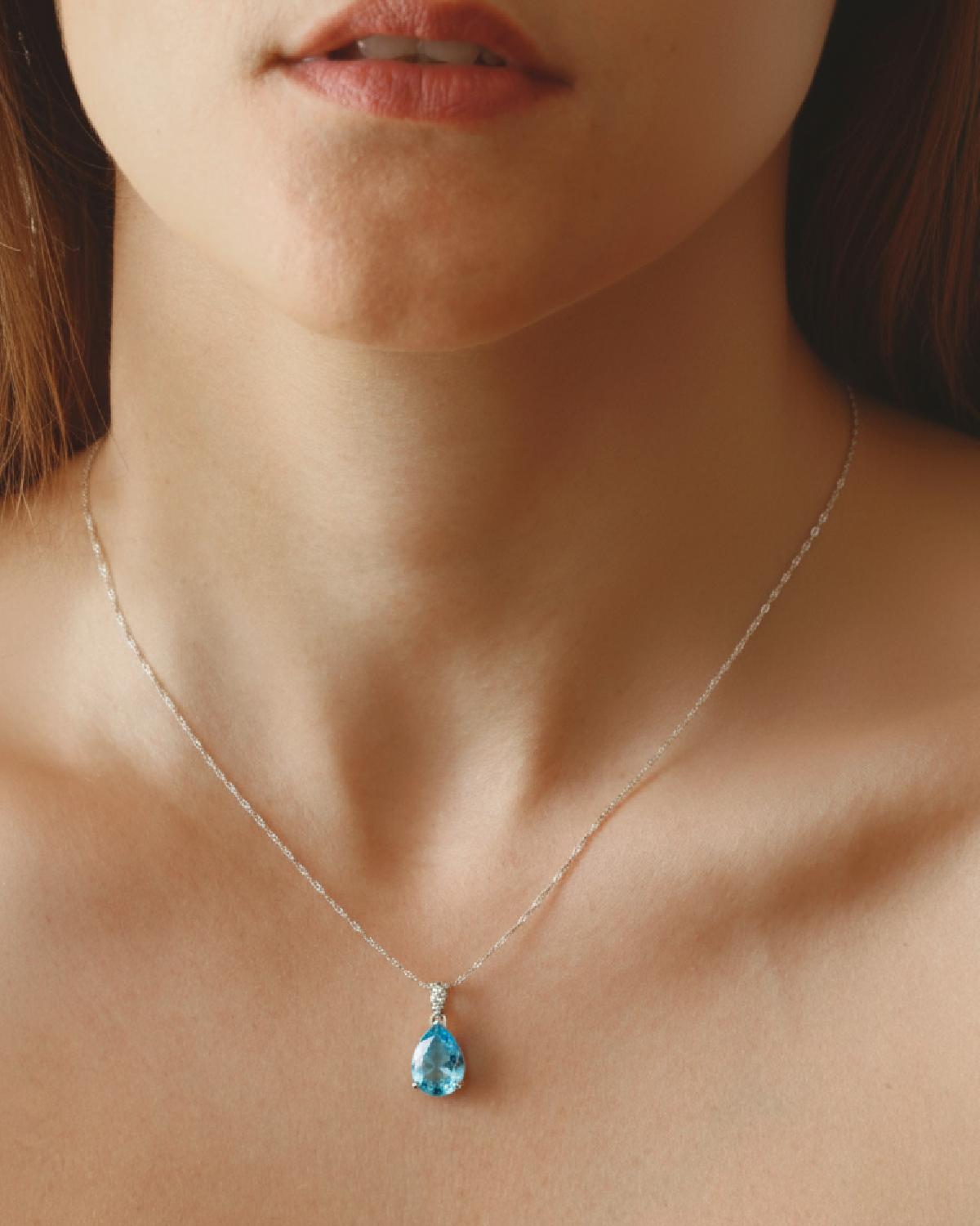 Model wearing Teardrop Blue Topaz Necklace Silver, ideal Daily Wear or Anniversary gift