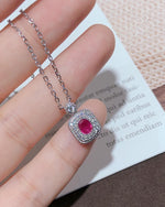 Lifestyle photography of Oval cut ruby halo necklace featuring Oval Cut center stone