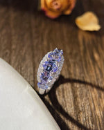 Lifestyle photography of Oval cut tanzanite ring blue violet featuring Oval Cut center stone