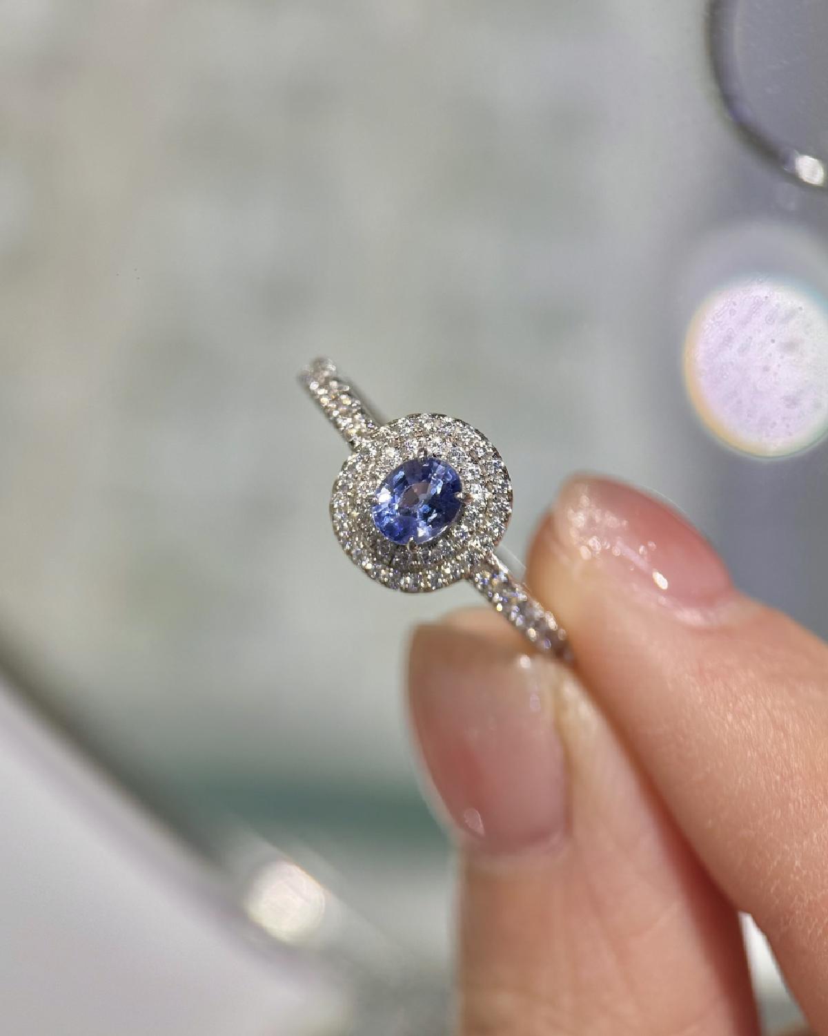 Real-life look at Oval Sapphire Ring Double Halo featuring Oval Cut center stone