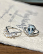 Lifestyle photography of Pear cut aquamarine halo ring featuring Pear Cut center stone