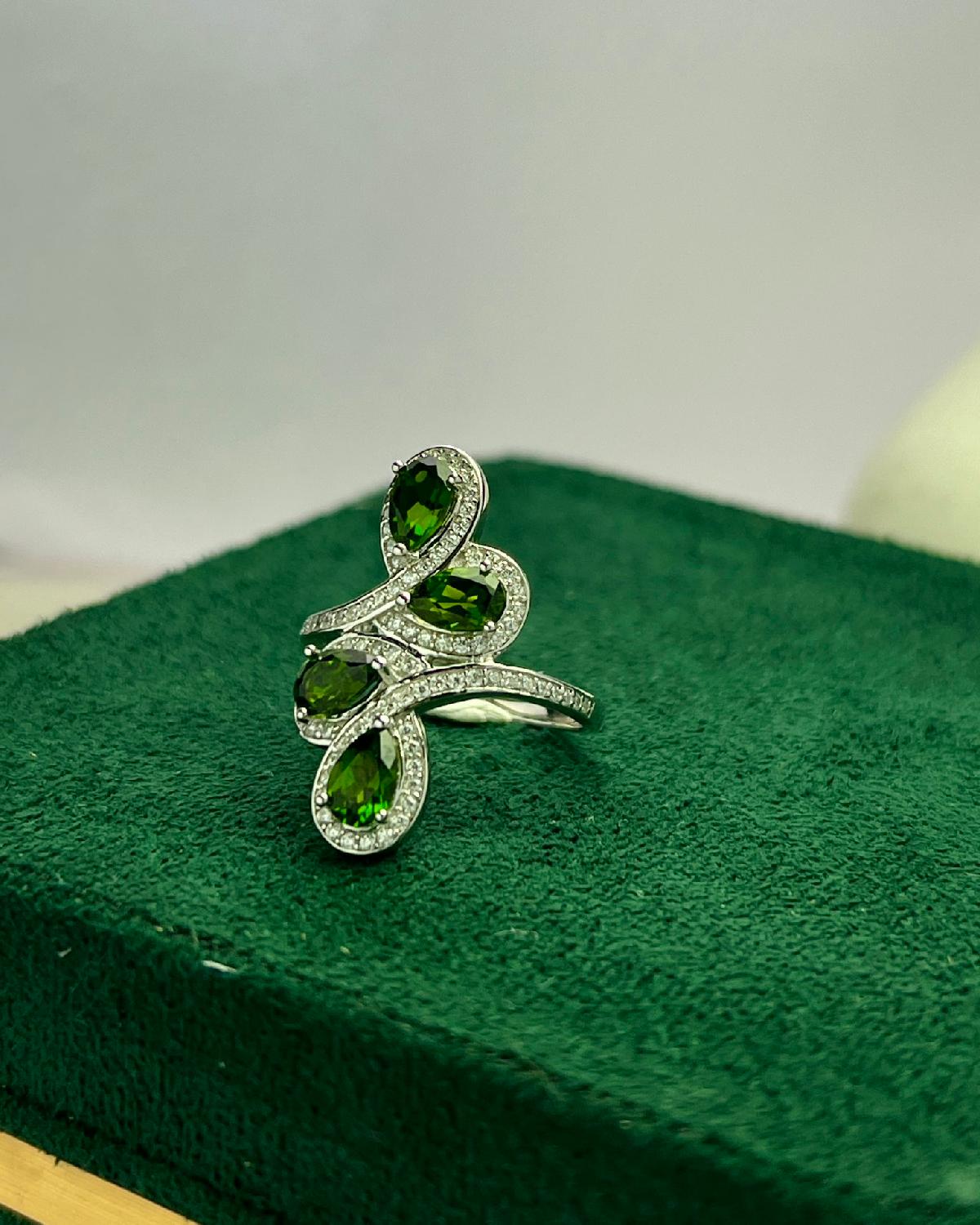 Lifestyle photography of Pear cut diopside halo ring featuring Pear Cut center stone