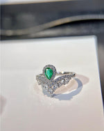 Lifestyle photography of Pear cut emerald tiara ring featuring Pear Cut center stone