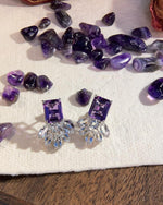 Lifestyle photography of Radiant cut amethyst floral earrings featuring Radint Cut ? center stone