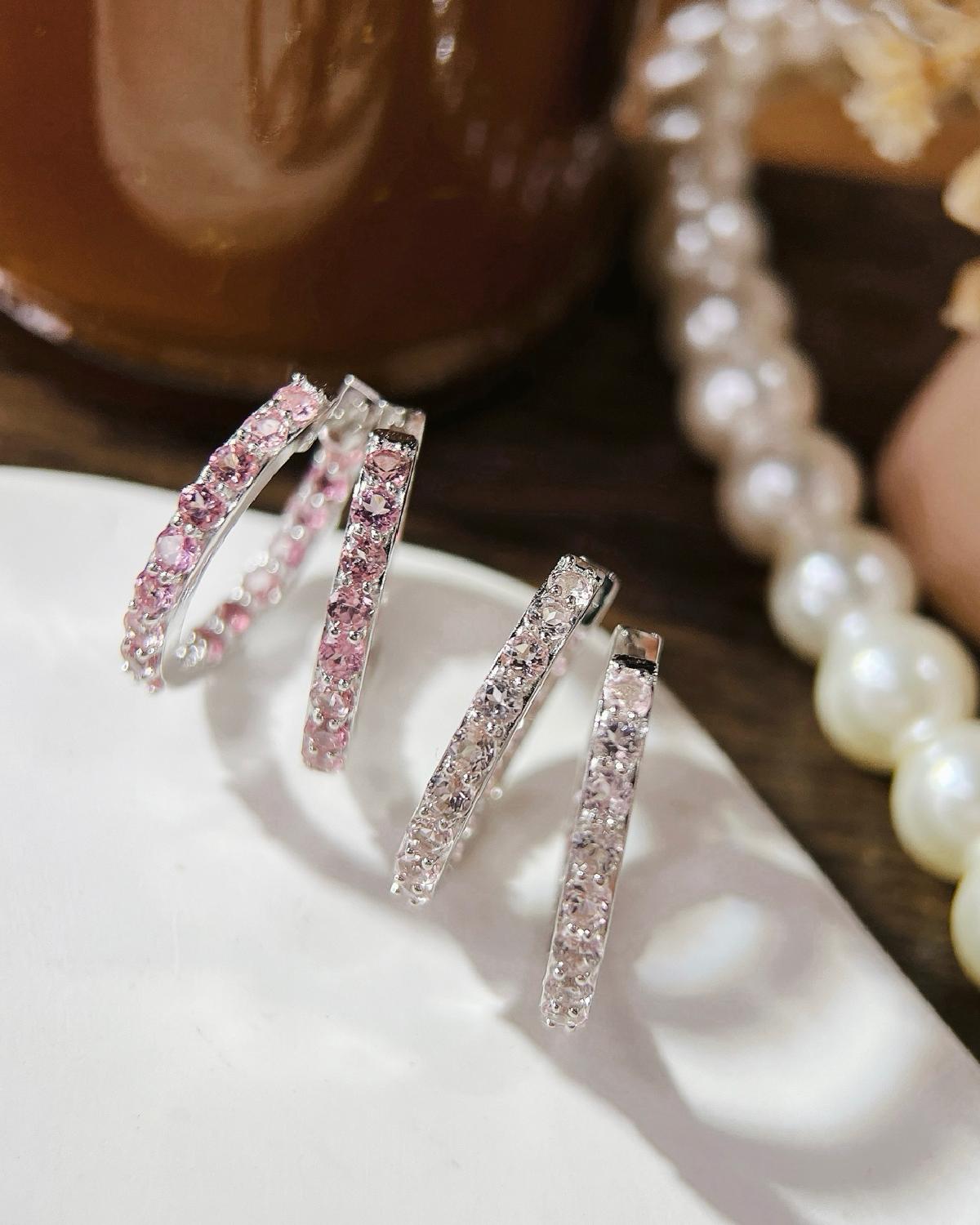 Lifestyle photography of Round cut pink tourmaline eternity earrings featuring Round Cut center stone