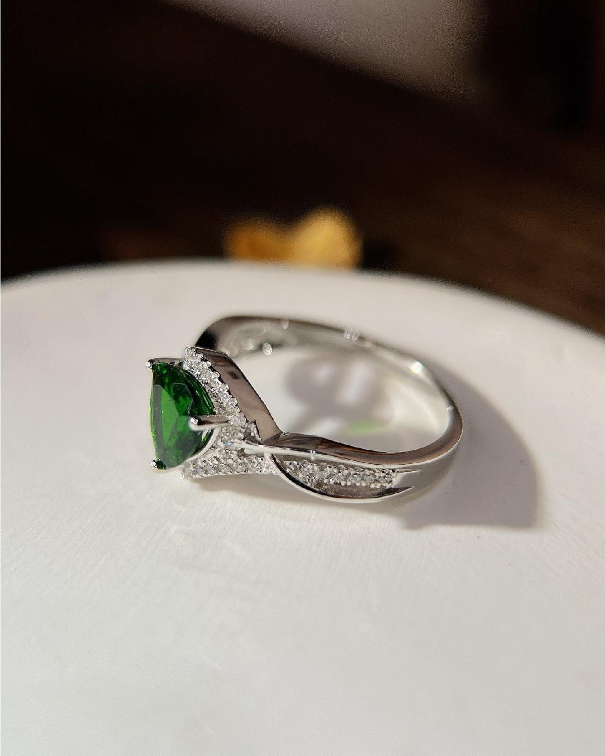 Lifestyle photography of Triangle cut diopside halo ring featuring Triangle Cut center stone